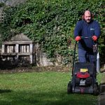White male Mark Walker gardener moving the lawn 5